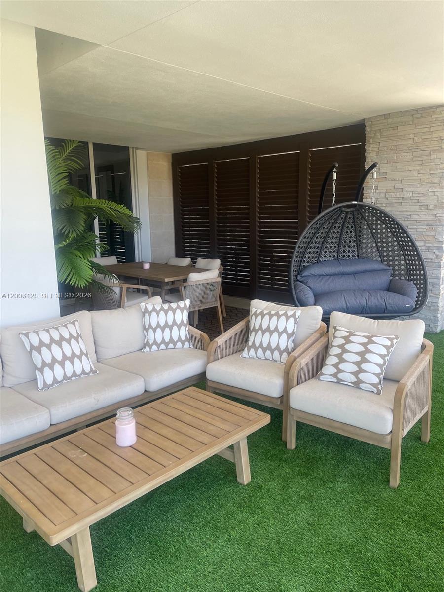 220 Southeast Mizner Boulevard, Unit 321 Boca Raton, FL 33432 - Photo 20 of 24 a view of a couches in patio of back yard