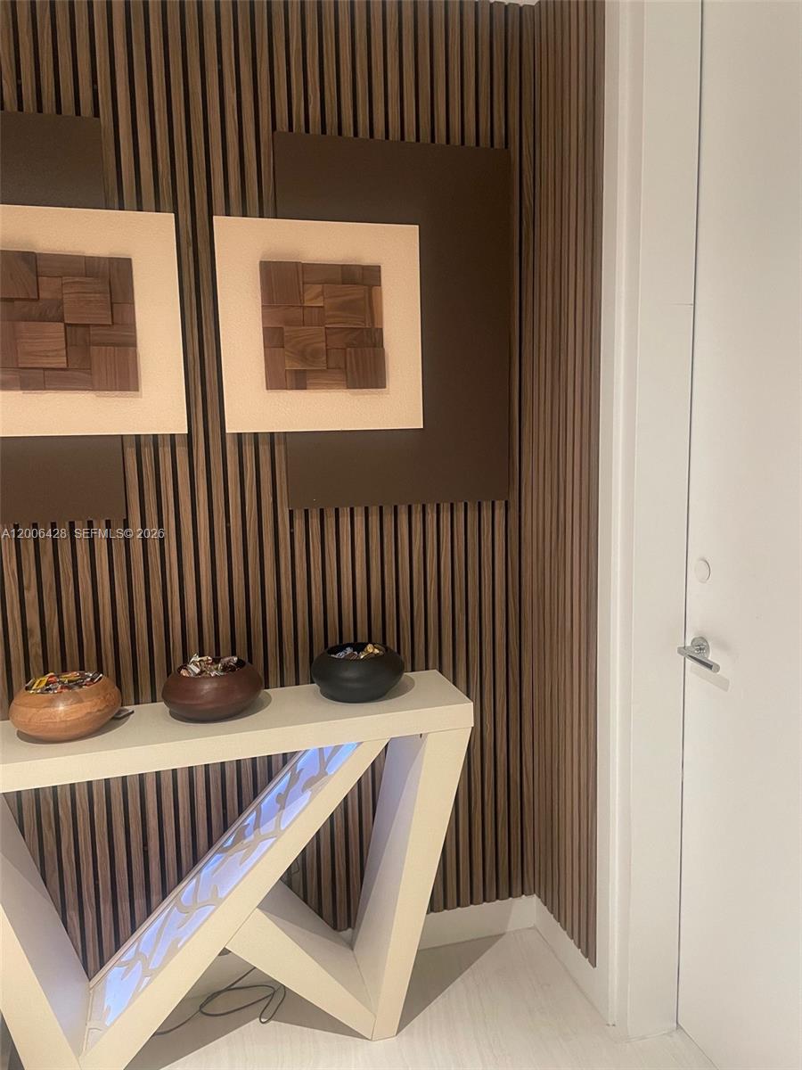 220 Southeast Mizner Boulevard, Unit 321 Boca Raton, FL 33432 - Photo 2 of 24 a bedroom with a bed and a window