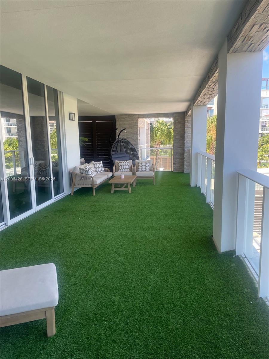 220 Southeast Mizner Boulevard, Unit 321 Boca Raton, FL 33432 - Photo 21 of 24 a view of a house with backyard porch and garden