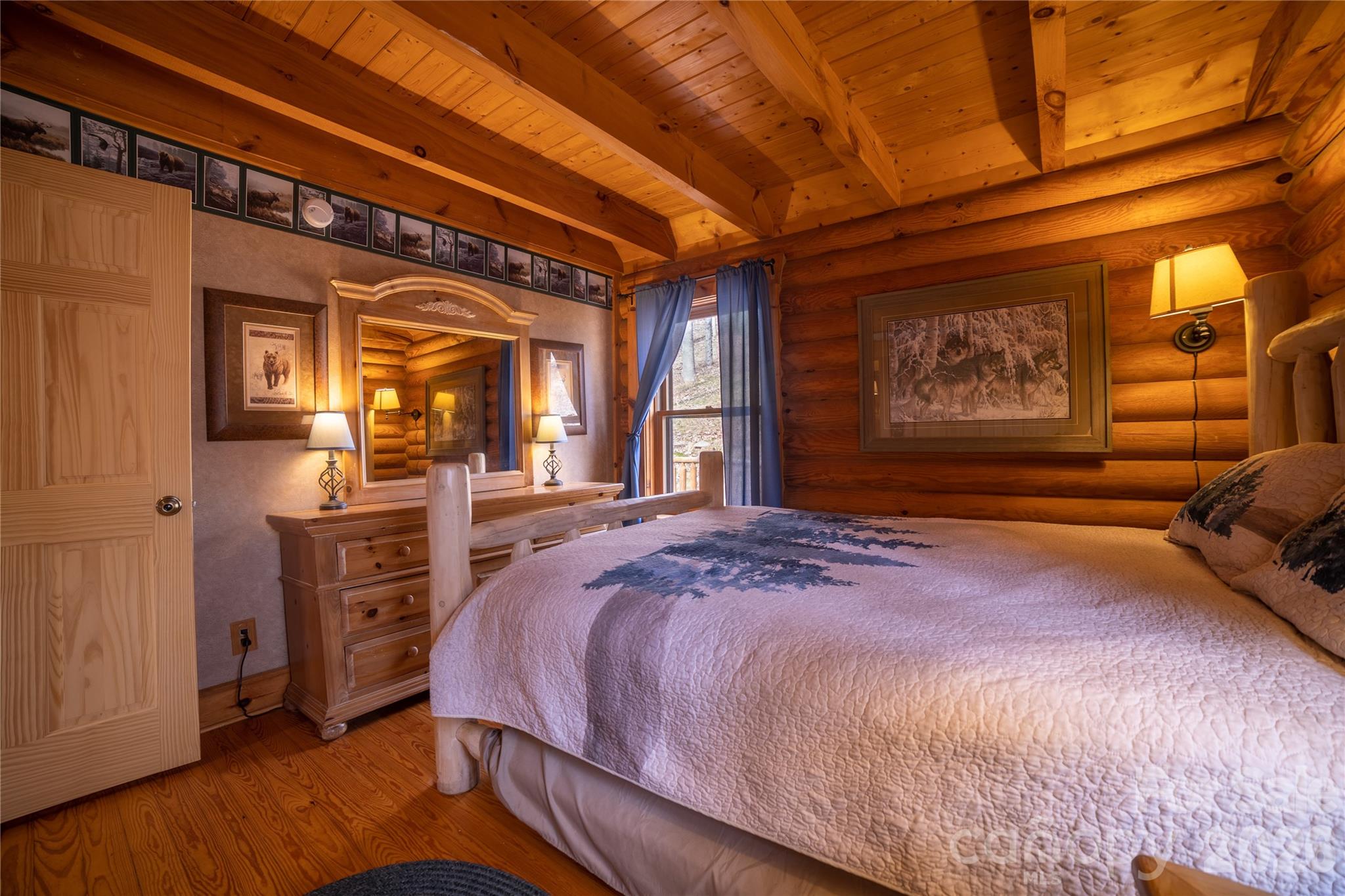 682 Rock House Road Hot Springs, NC 28743 - Photo 16 of 43 a spacious bedroom with a bed and a dresser