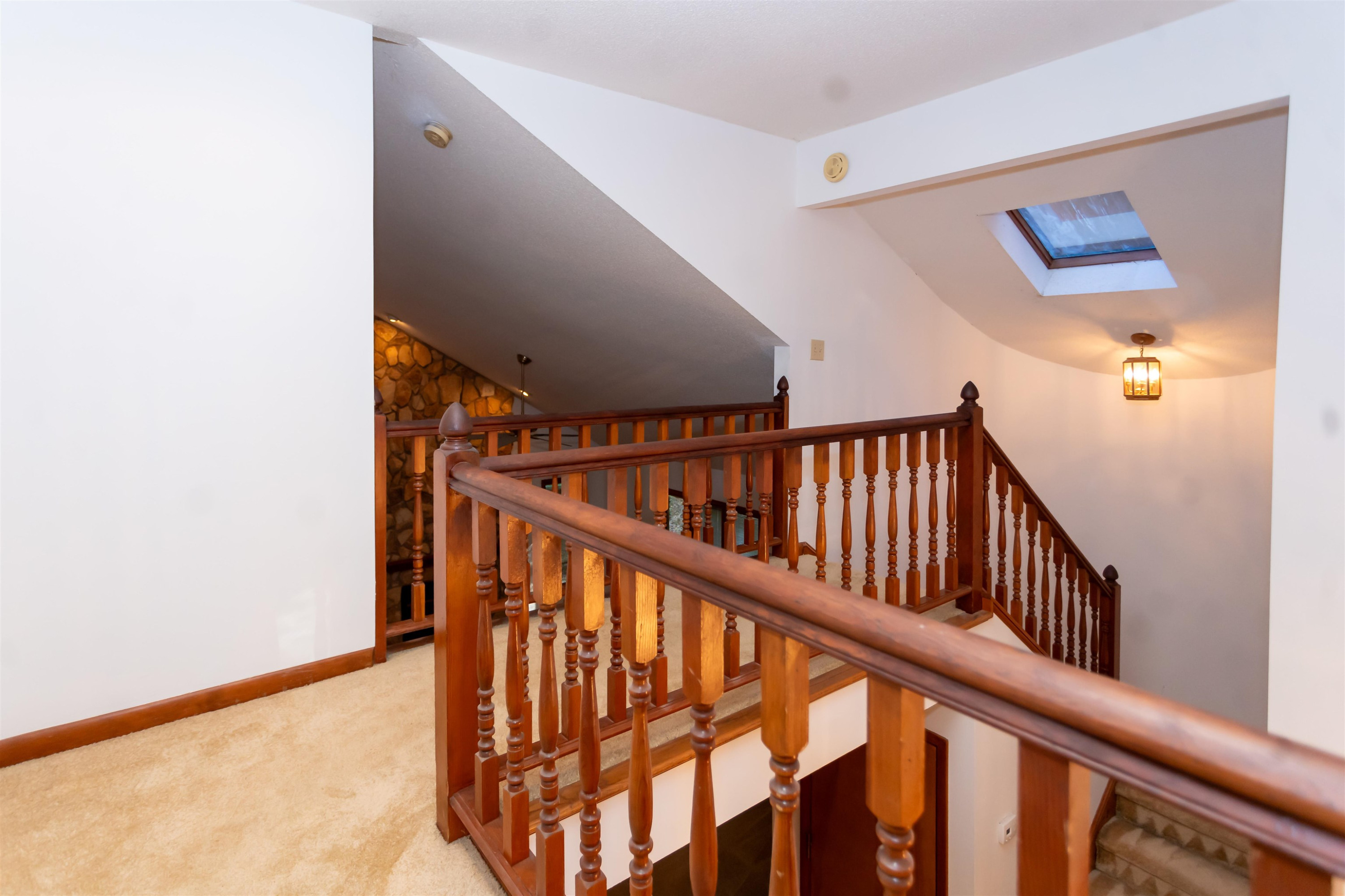 7816 Netherlands Drive Raleigh, NC 27606 - Photo 17 of 60 a view of staircase with railing and white walls