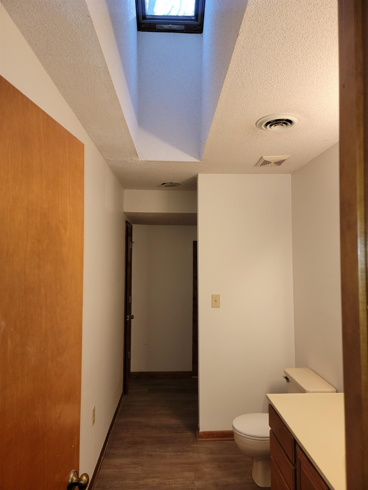 7816 Netherlands Drive Raleigh, NC 27606 - Photo 24 of 60 a bathroom with a sink and a toilet