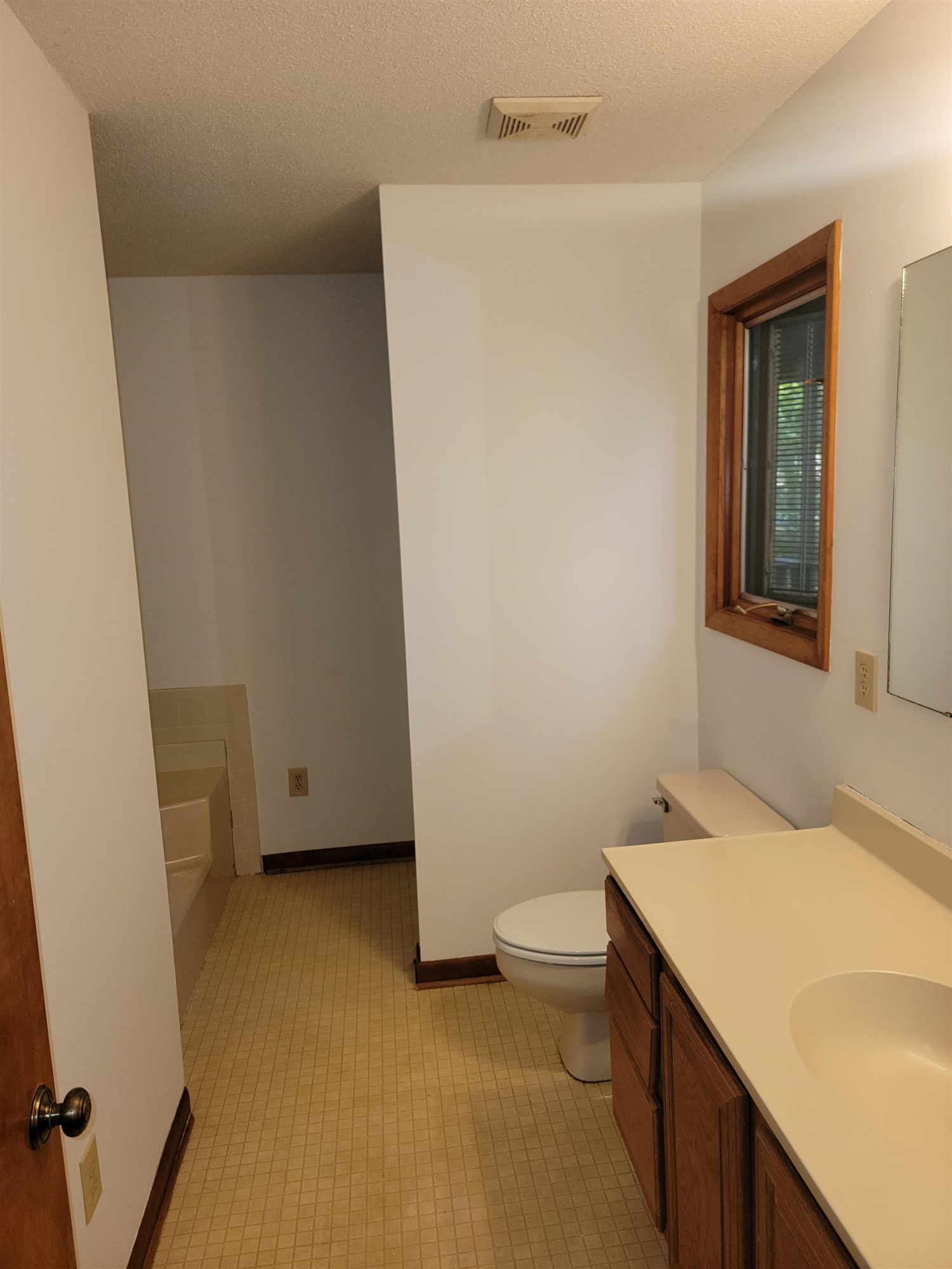 7816 Netherlands Drive Raleigh, NC 27606 - Photo 26 of 60 a bathroom with a sink a toilet and a tub