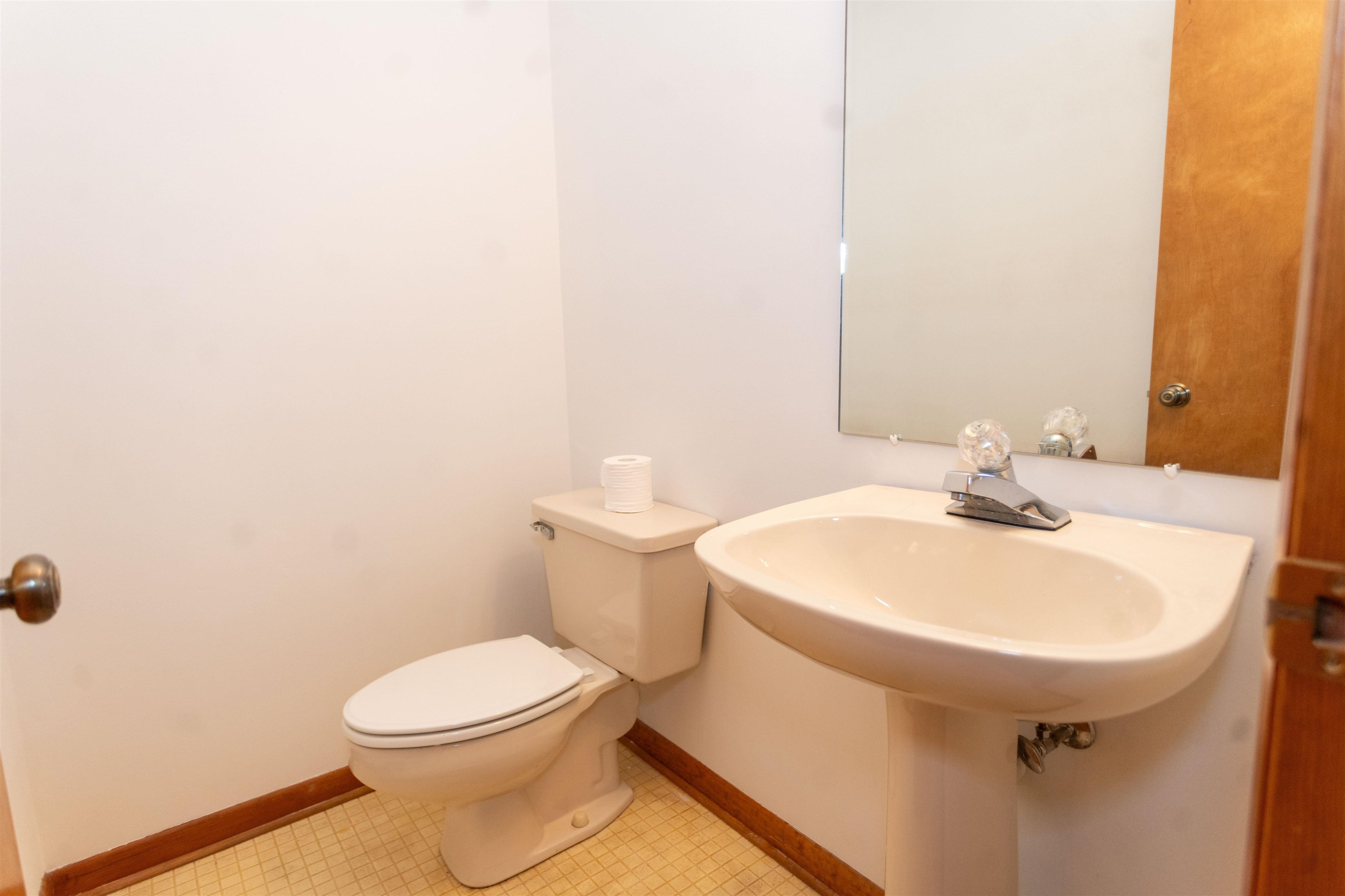 7816 Netherlands Drive Raleigh, NC 27606 - Photo 27 of 60 a bathroom with a sink a toilet and mirror