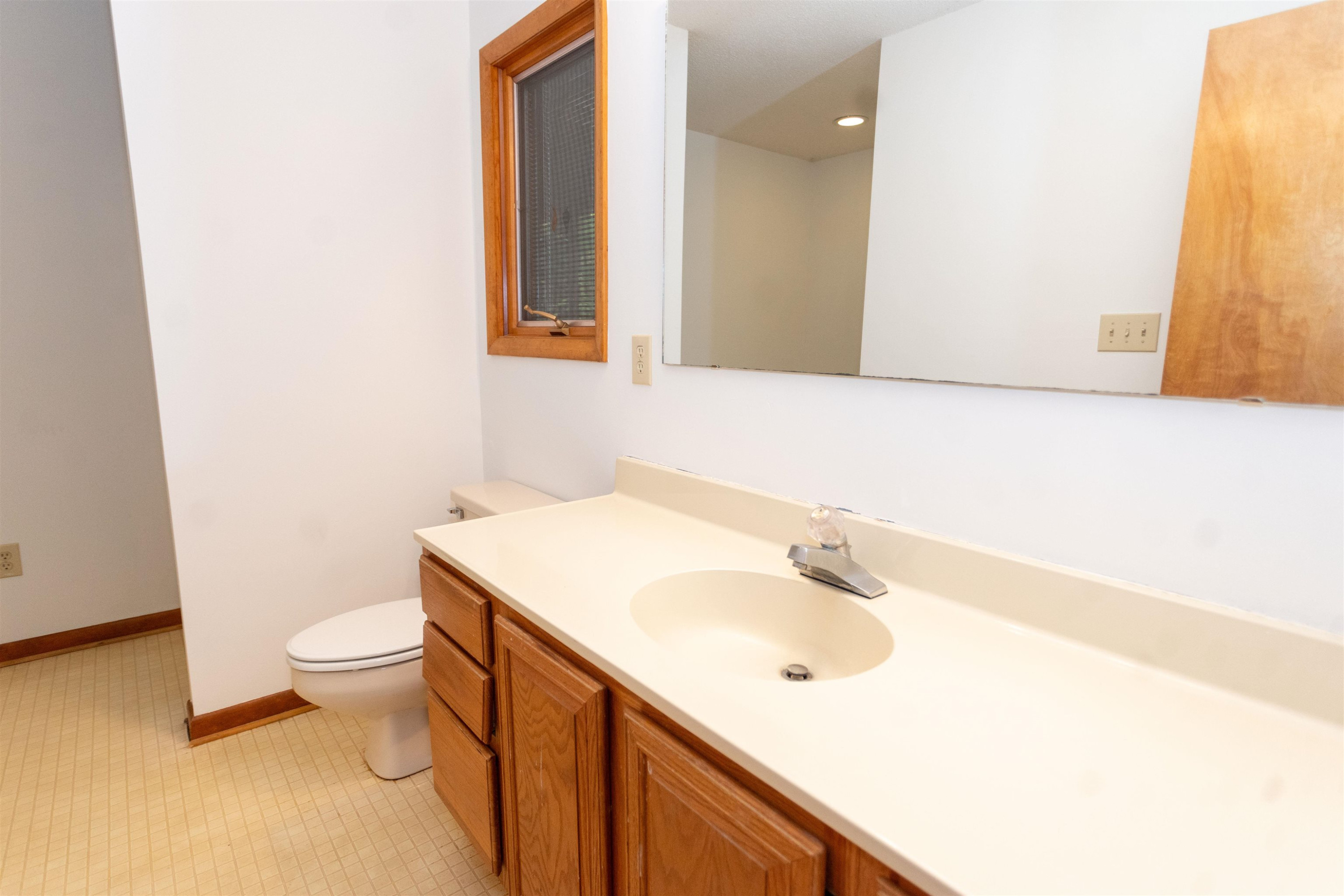 7816 Netherlands Drive Raleigh, NC 27606 - Photo 33 of 60 a bathroom with a sink and a mirror