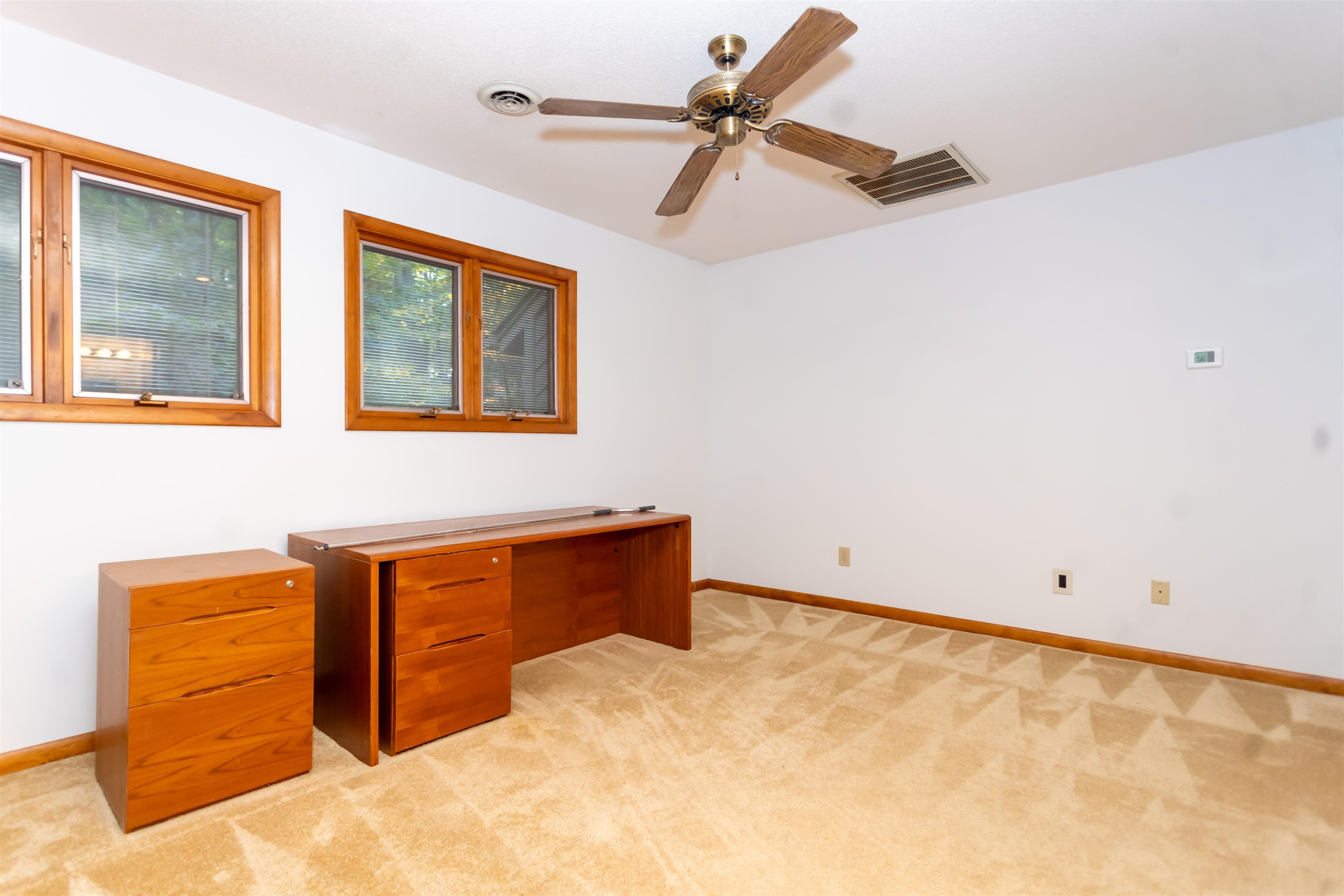 7816 Netherlands Drive Raleigh, NC 27606 - Photo 37 of 60 a room with ceiling fan
