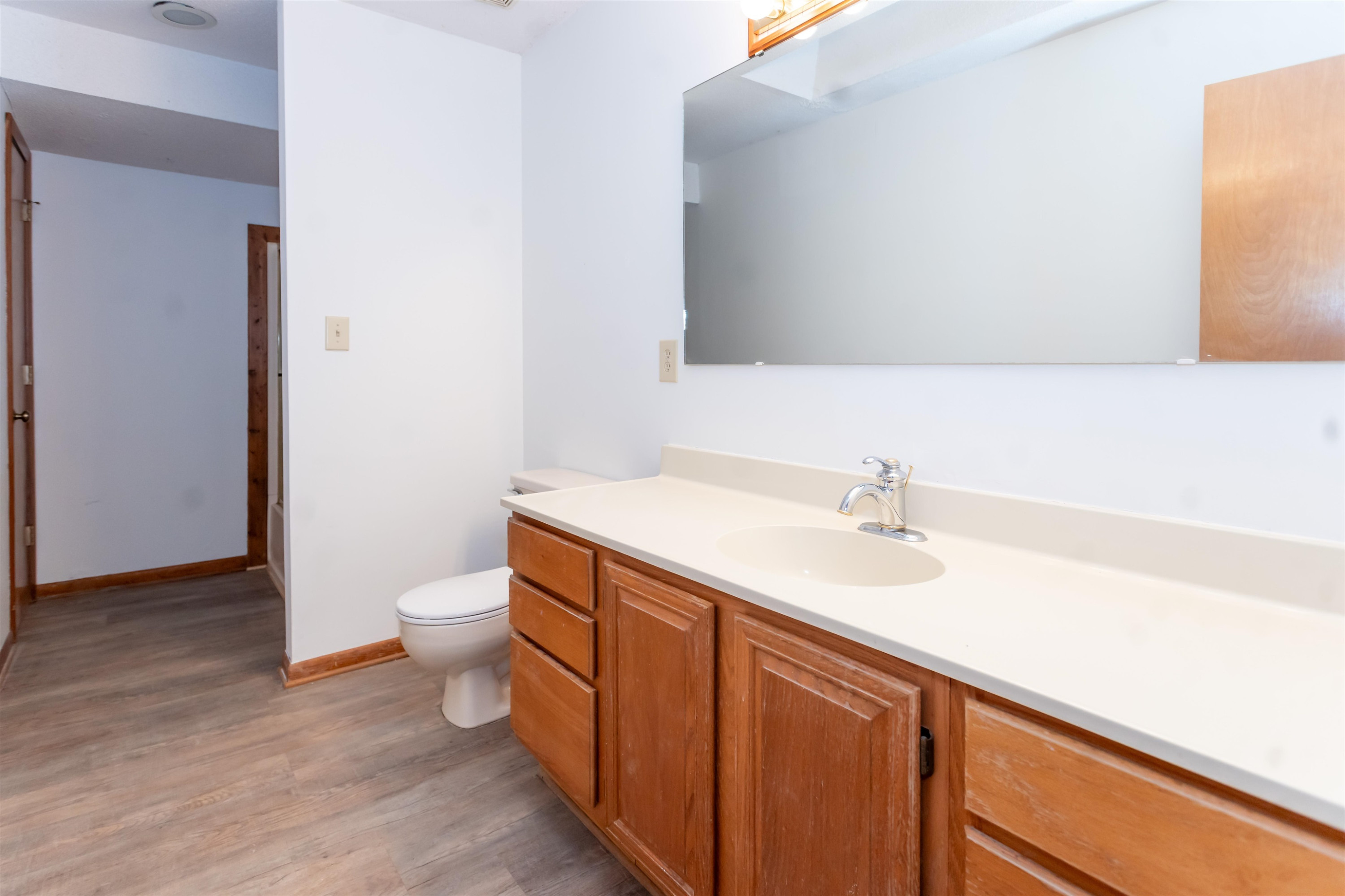 7816 Netherlands Drive Raleigh, NC 27606 - Photo 39 of 60 a bathroom with a sink and a toilet