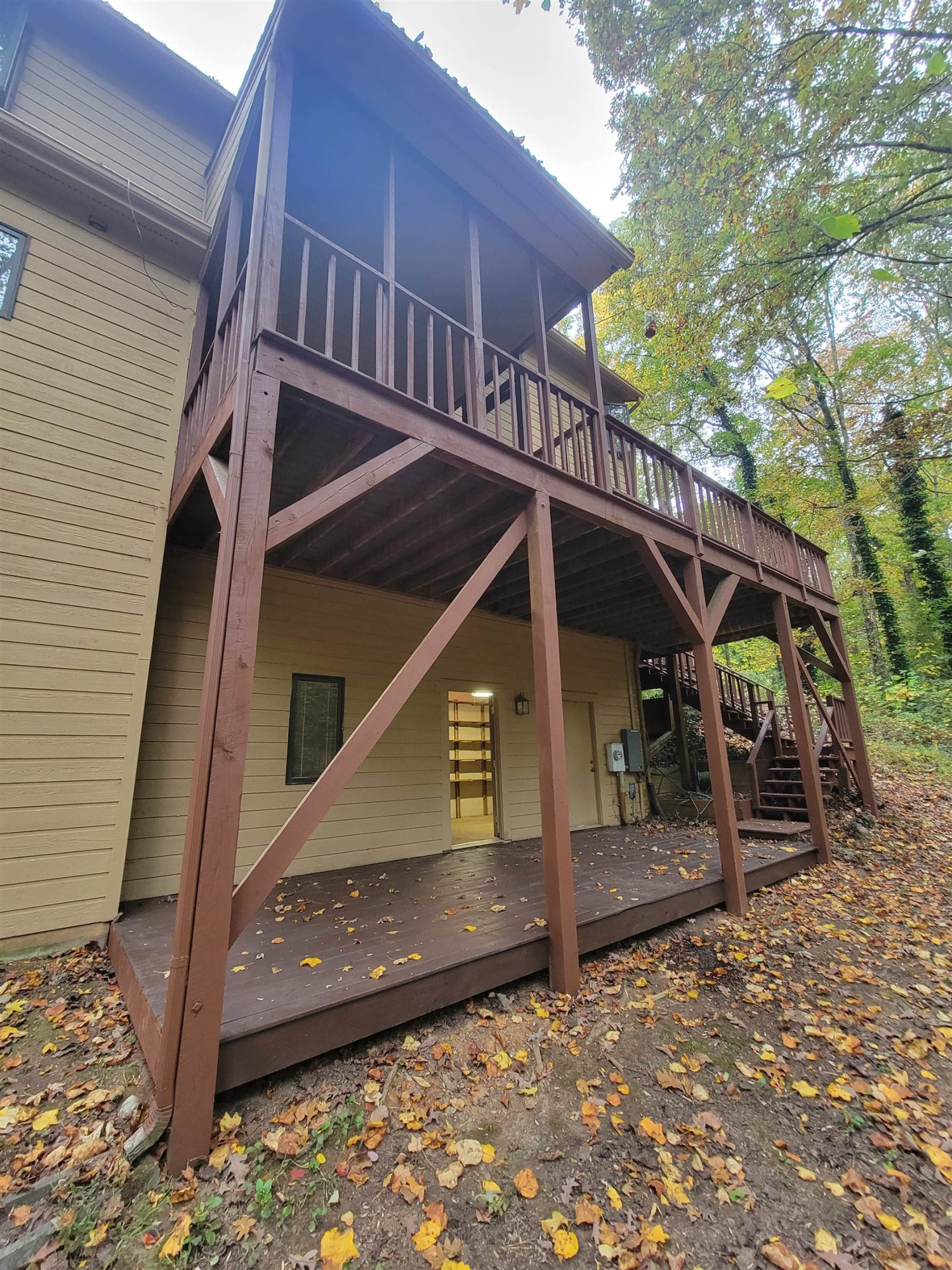 7816 Netherlands Drive Raleigh, NC 27606 - Photo 51 of 60 a view of a house with a wooden deck