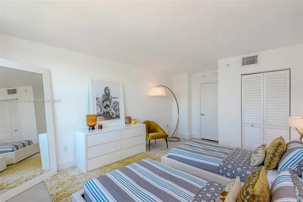 a bedroom with double bed and a window