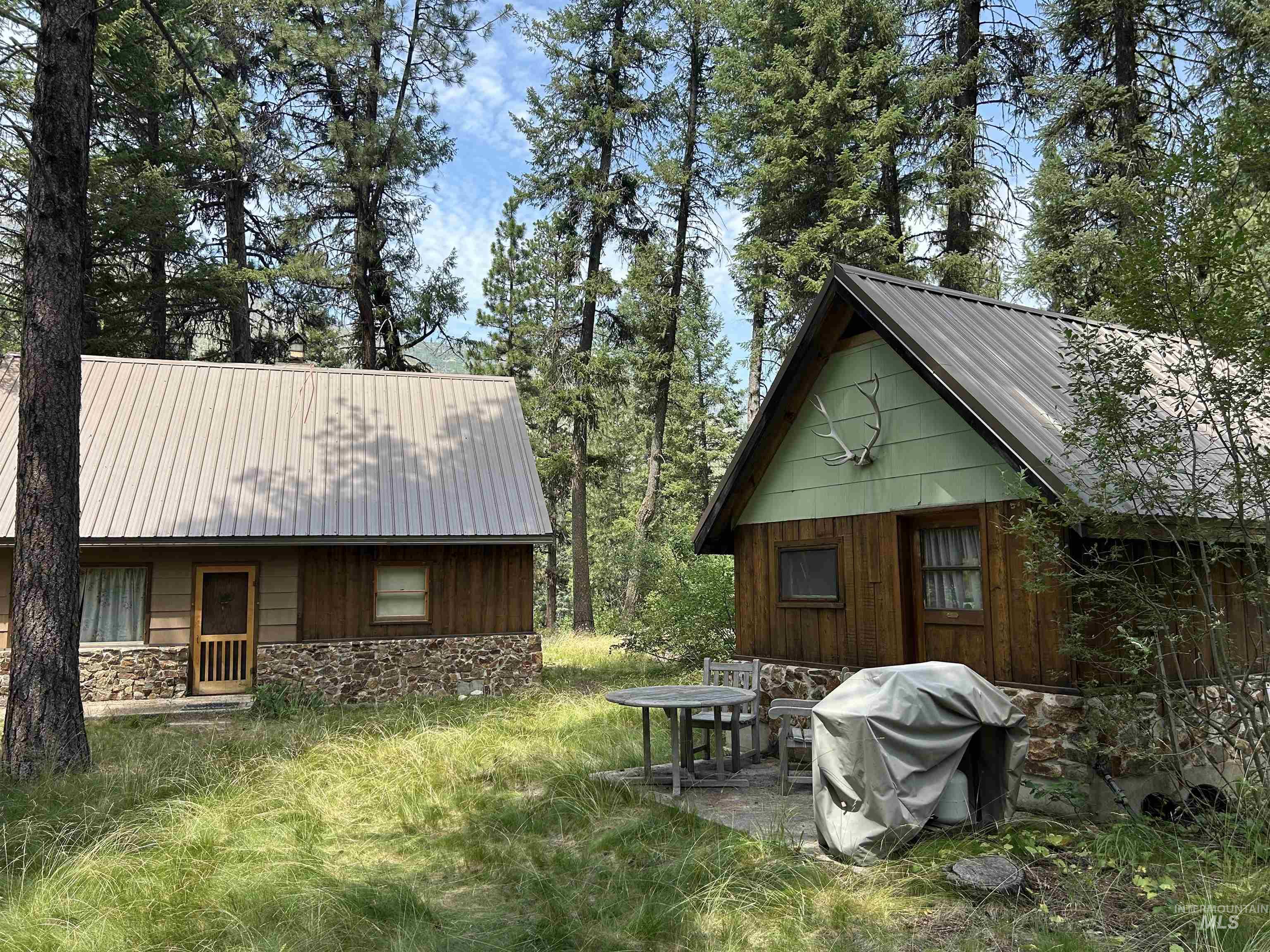 44 Long Creek Road Lowman, ID 83637 - Photo 3 of 42 A-frame style residence featuring a metal roof and a stone foundation