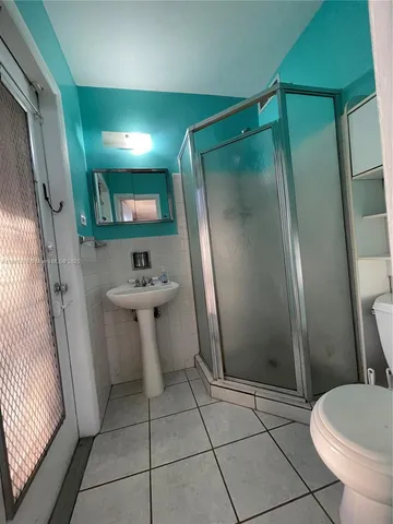 a bathroom with a sink and mirror