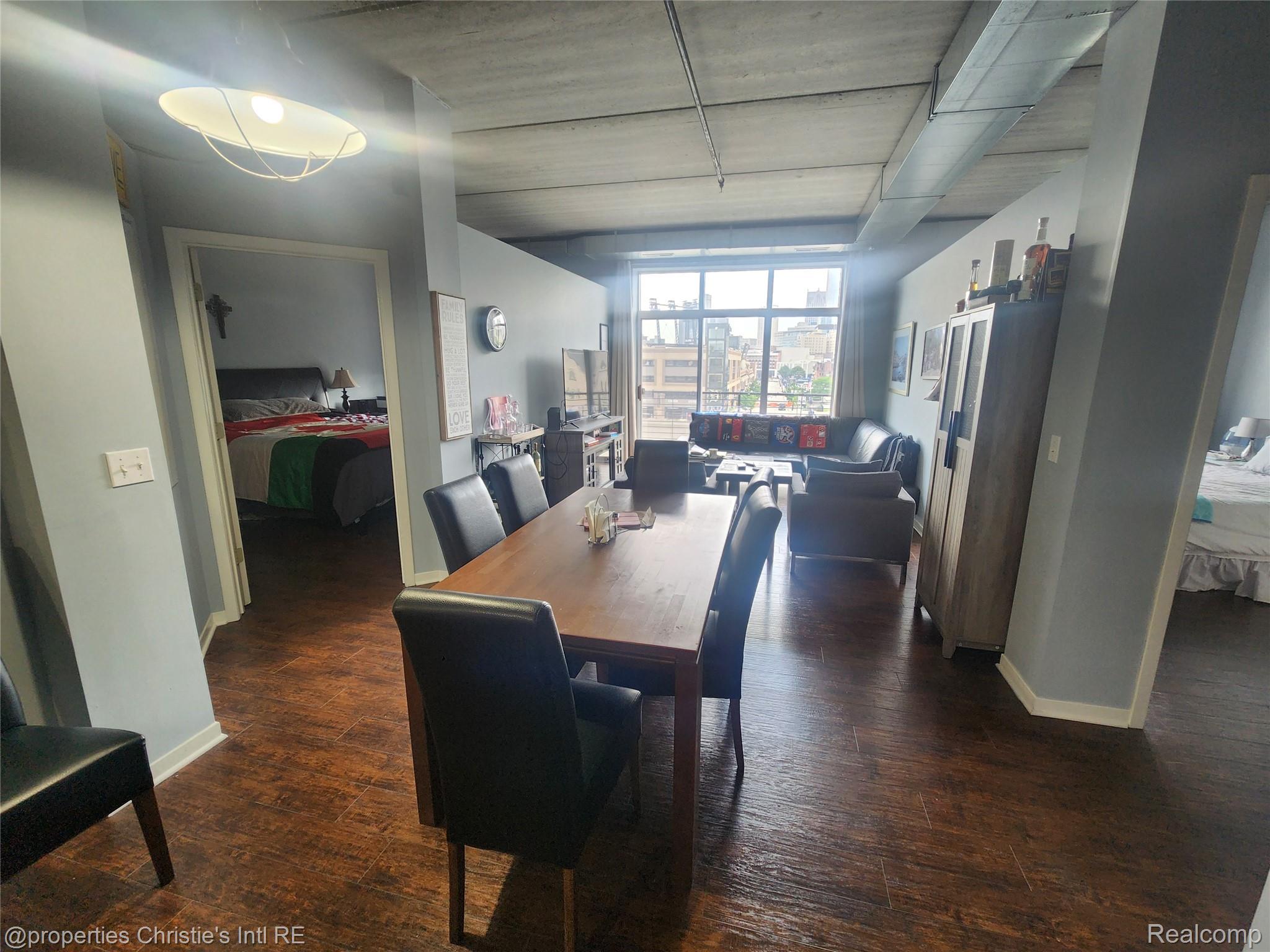 66 Winder Street, Unit 458 Detroit, MI 48201 - Photo 7 of 19 Dining space featuring dark wood-type flooring and baseboards
