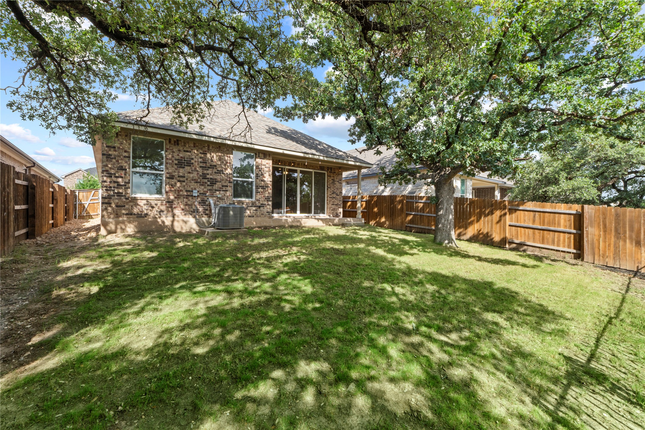 341 Peace Pipe Way Georgetown, TX 78628 - Photo 27 of 28 Shade trees help keep things cool on this greenbelt home site.
