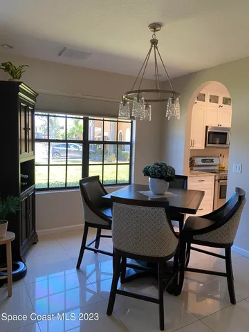 a view of a livingroom with furniture window and wooden floor