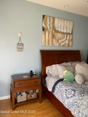 a bathroom with a toilet a sink and a large window