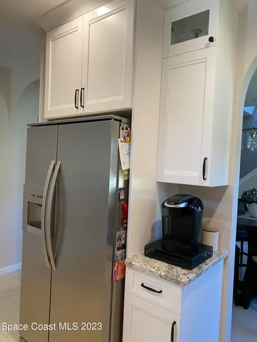 a kitchen with a stove and a refrigerator