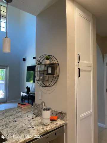 a kitchen with kitchen island granite countertop a table and chairs in it