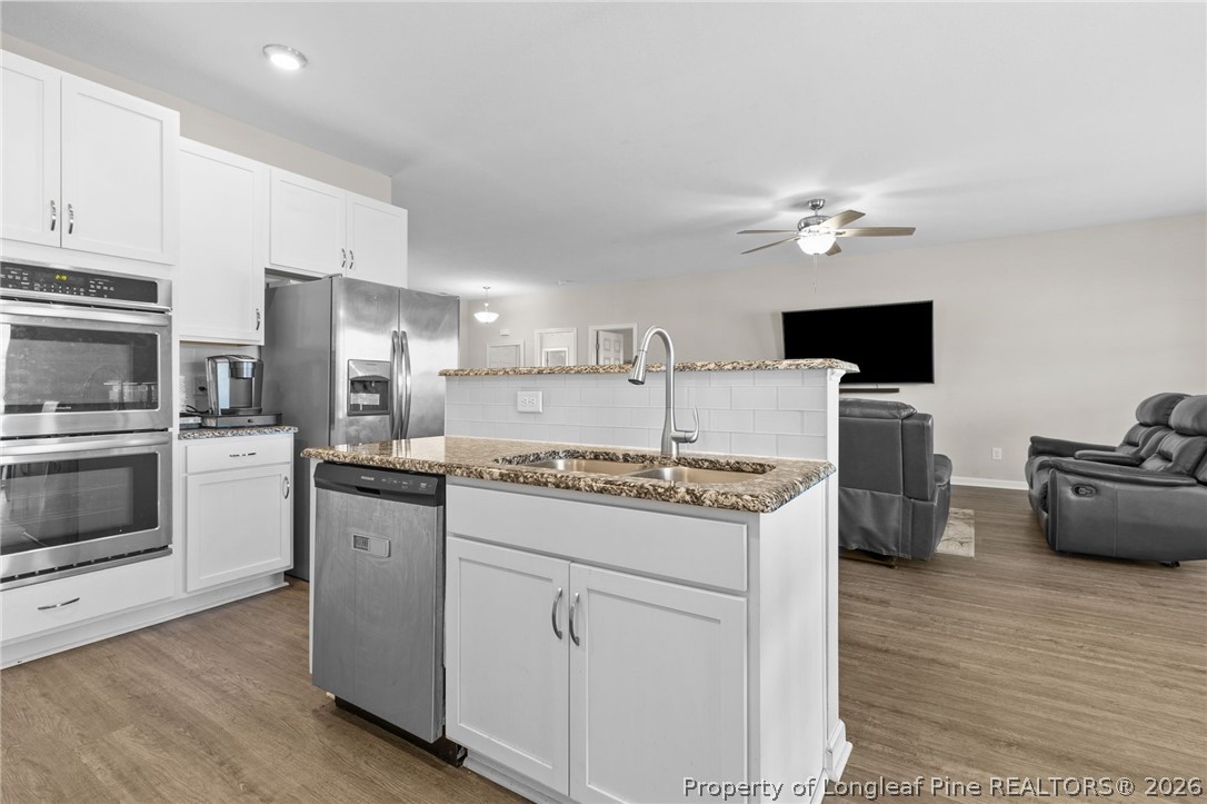 3298 Deep Branch Road Lumberton, NC 28360 - Photo 13 of 41 a kitchen with stainless steel appliances a stove refrigerator sink and microwave