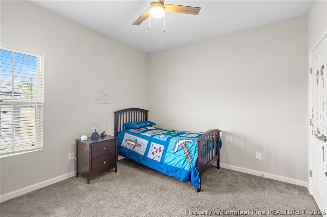 3298 Deep Branch Road Lumberton, NC 28360 - Photo 22 of 41 a bedroom with a bed and a window
