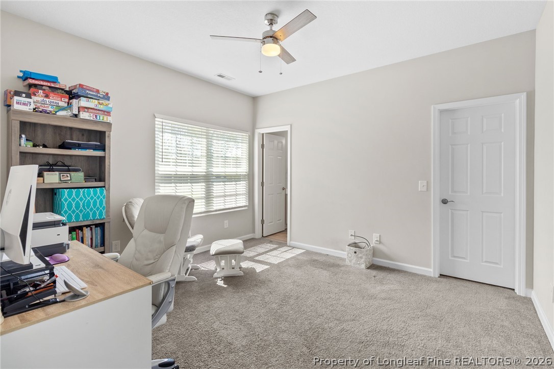 3298 Deep Branch Road Lumberton, NC 28360 - Photo 28 of 41 a view of a workspace with furniture and a window