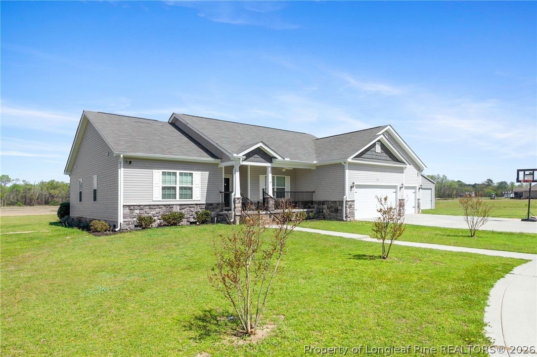 3298 Deep Branch Road Lumberton, NC 28360 - Photo 3 of 41 a view of a house with a big yard and sitting area