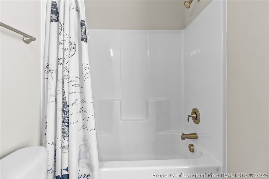 3298 Deep Branch Road Lumberton, NC 28360 - Photo 31 of 41 a bathroom with a bathtub and a shower