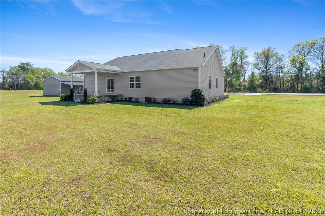 3298 Deep Branch Road Lumberton, NC 28360 - Photo 35 of 41 a front view of house with yard and trees in the background