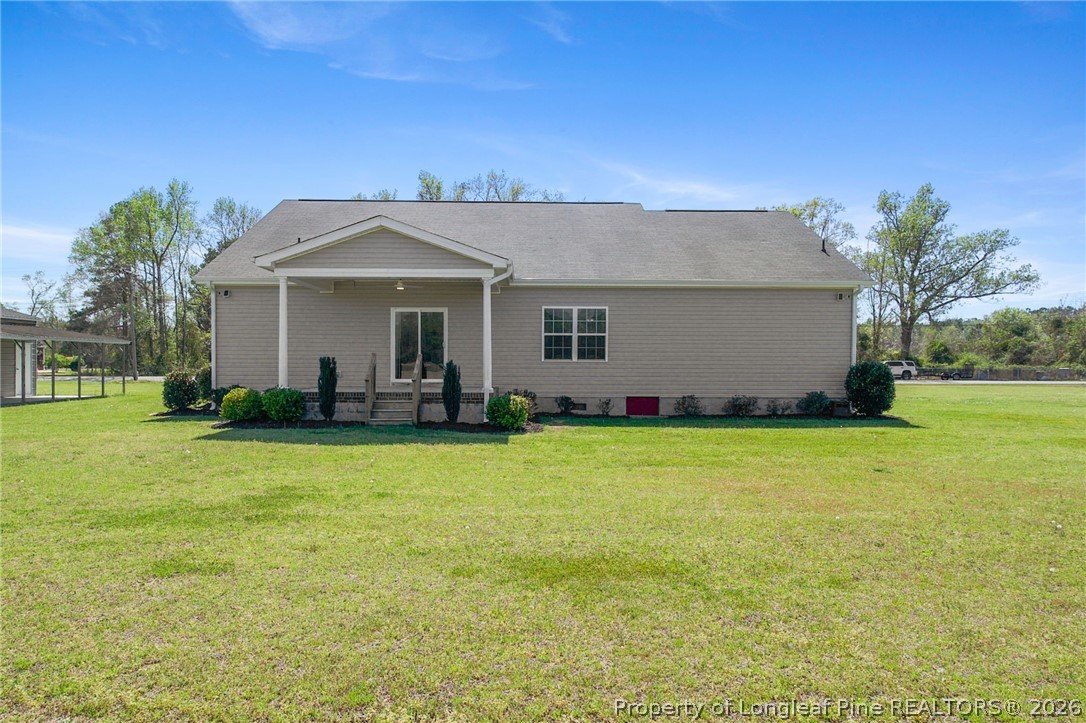 3298 Deep Branch Road Lumberton, NC 28360 - Photo 36 of 41 a front view of a house with garden