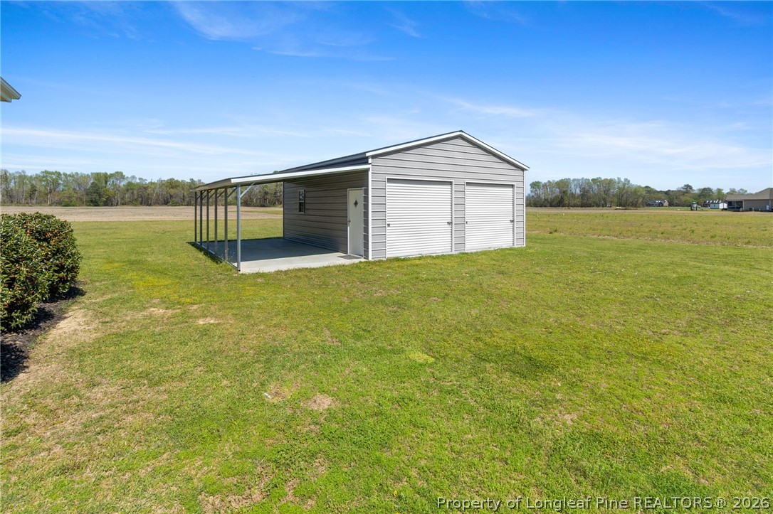 3298 Deep Branch Road Lumberton, NC 28360 - Photo 37 of 41 a view of a house with a yard