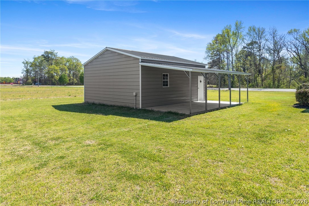 3298 Deep Branch Road Lumberton, NC 28360 - Photo 38 of 41 a view of a backyard of the house