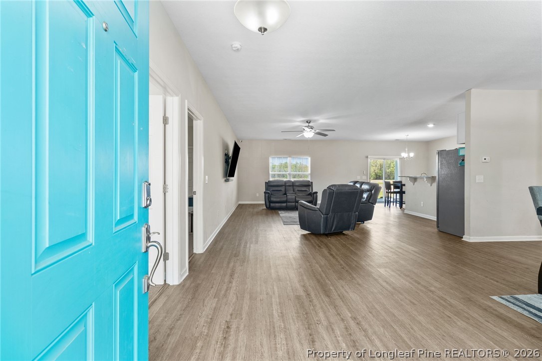 3298 Deep Branch Road Lumberton, NC 28360 - Photo 5 of 41 a living room with furniture and a wooden floor