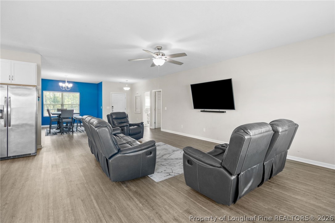 3298 Deep Branch Road Lumberton, NC 28360 - Photo 7 of 41 a living room with furniture and a flat screen tv