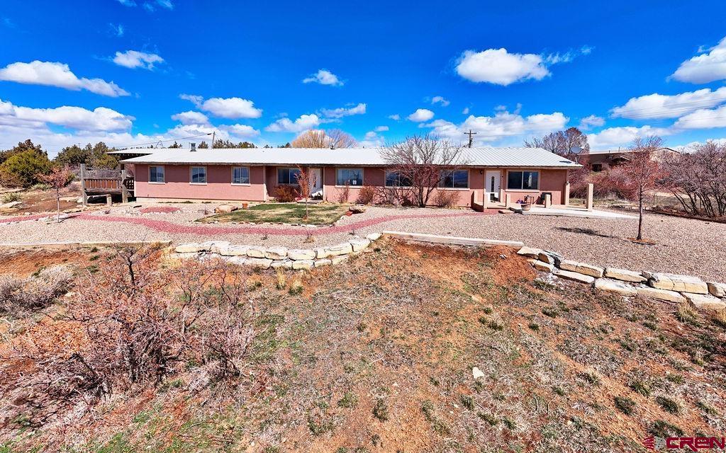27980 Rd T Dolores, CO 81323 - Photo 2 of 29 a view of a big house with a big yard and large tree