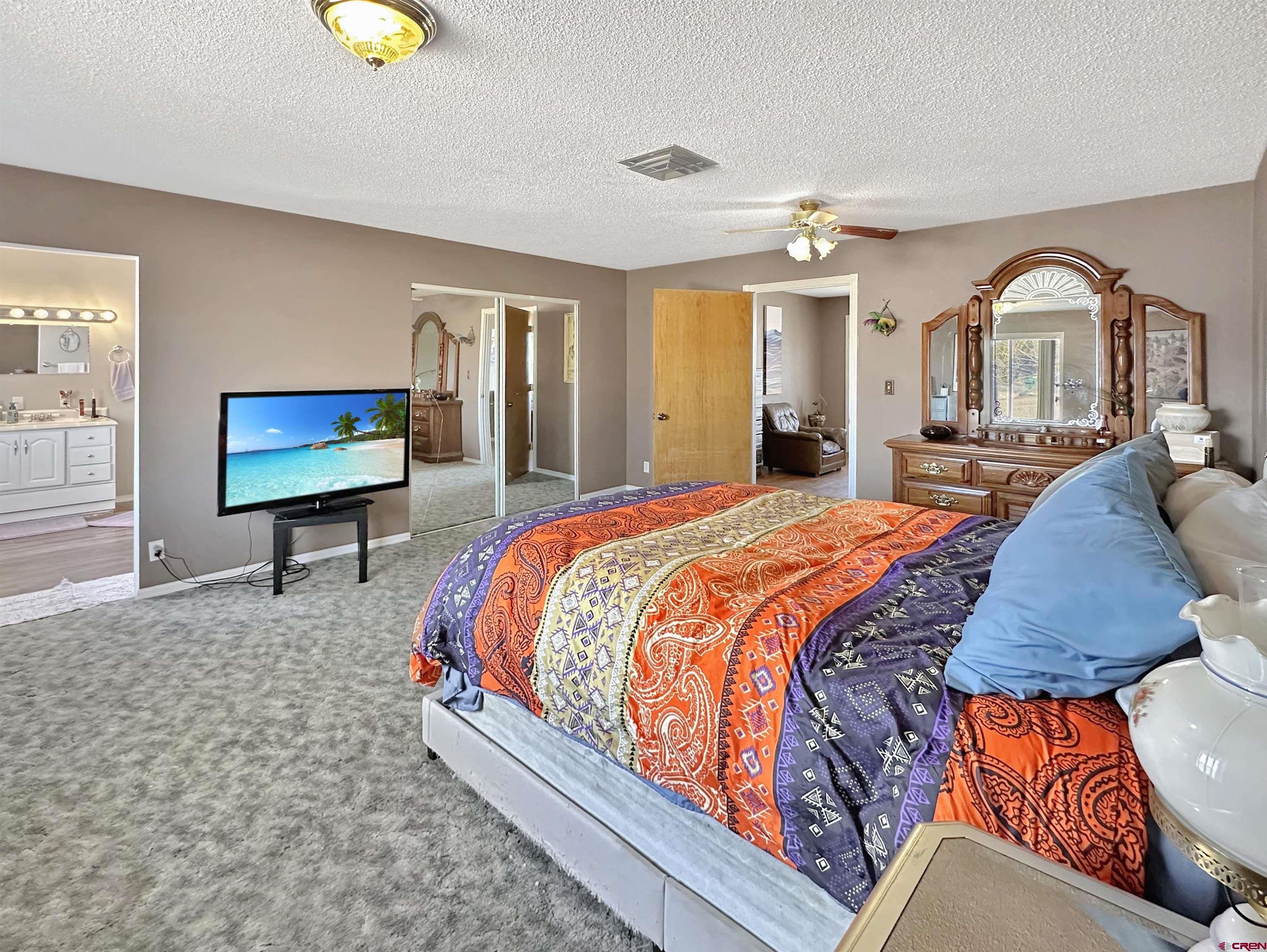 27980 Rd T Dolores, CO 81323 - Photo 7 of 29 a bedroom with a bed and dresser