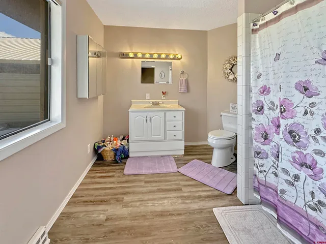 a spacious bathroom with a sink and a mirror