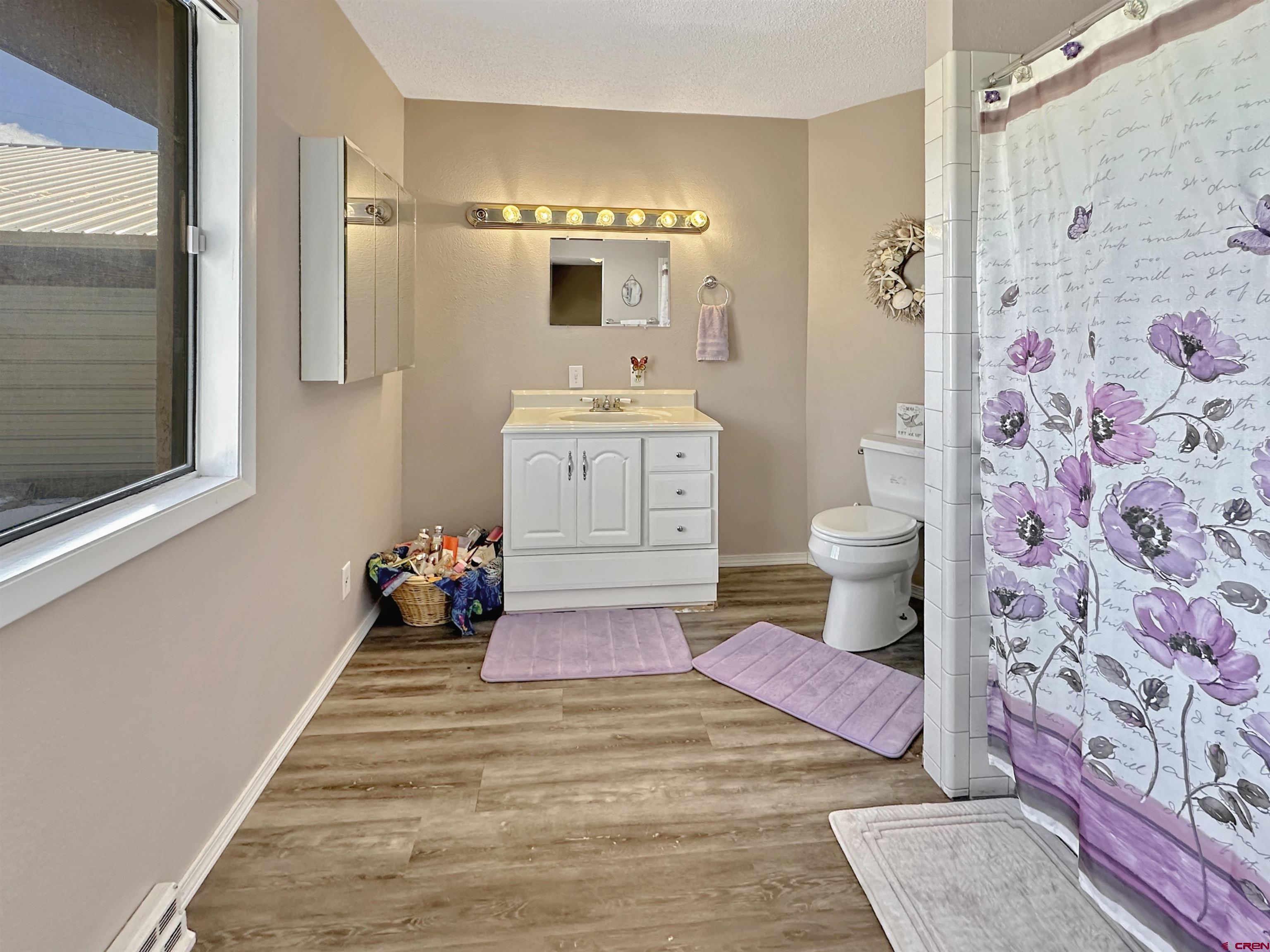 27980 Rd T Dolores, CO 81323 - Photo 9 of 29 a bathroom with a sink and a mirror