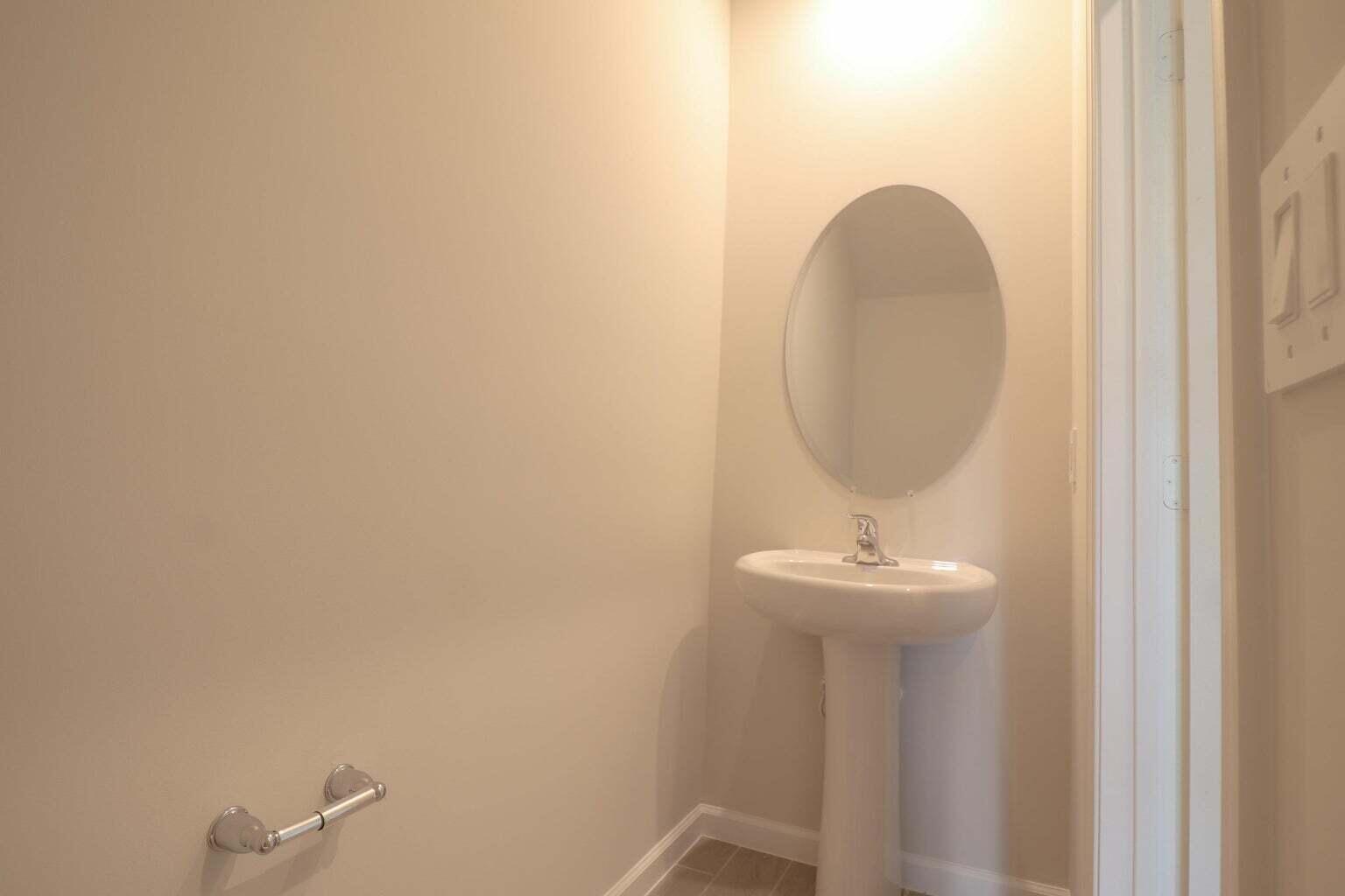 357 Southeast Angler Drive Stuart, FL 34994 - Photo 12 of 25 a bathroom with a sink and a mirror