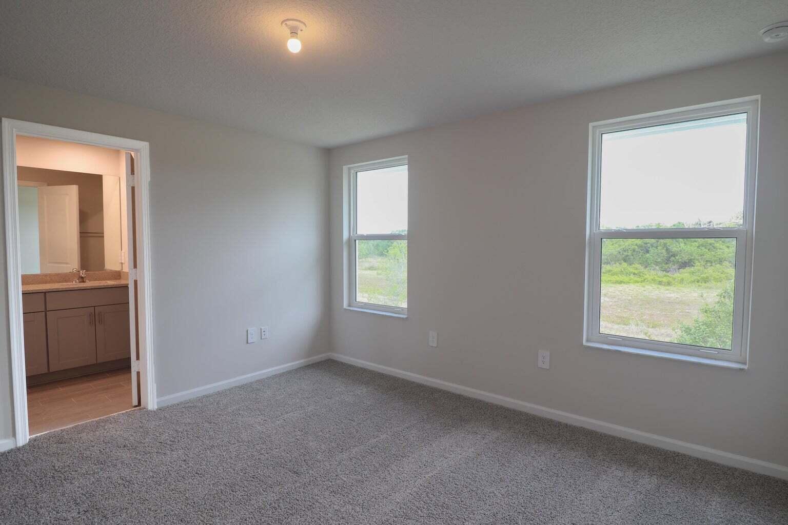 357 Southeast Angler Drive Stuart, FL 34994 - Photo 16 of 25 an empty room with windows and closet