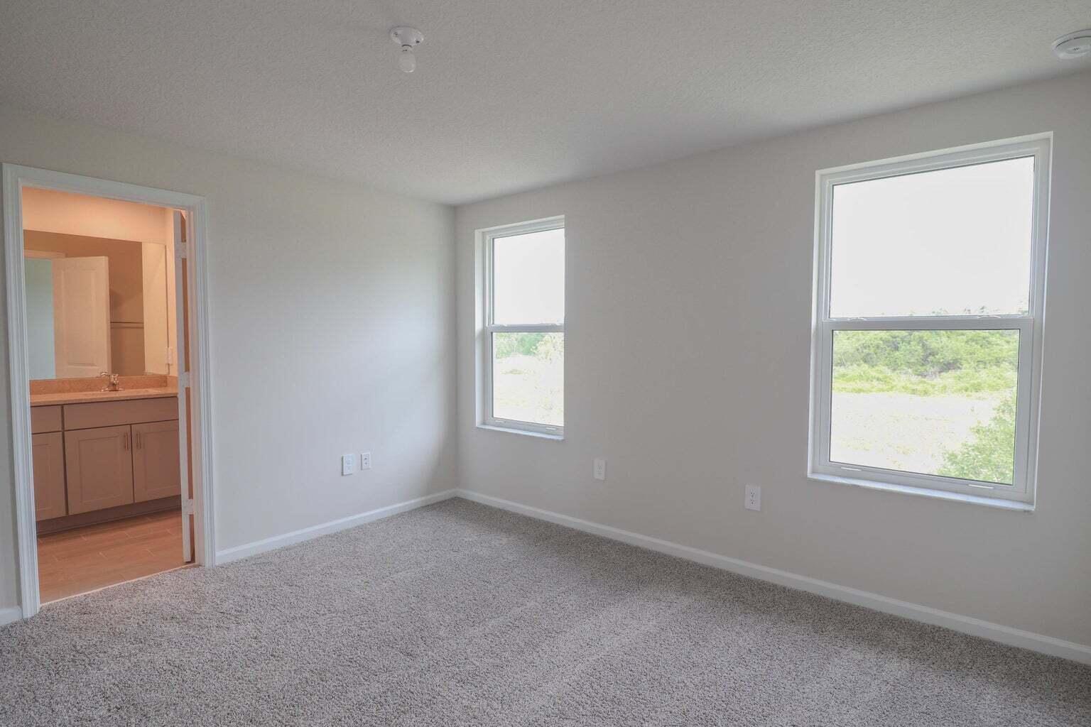 357 Southeast Angler Drive Stuart, FL 34994 - Photo 17 of 25 an empty room with windows and closet