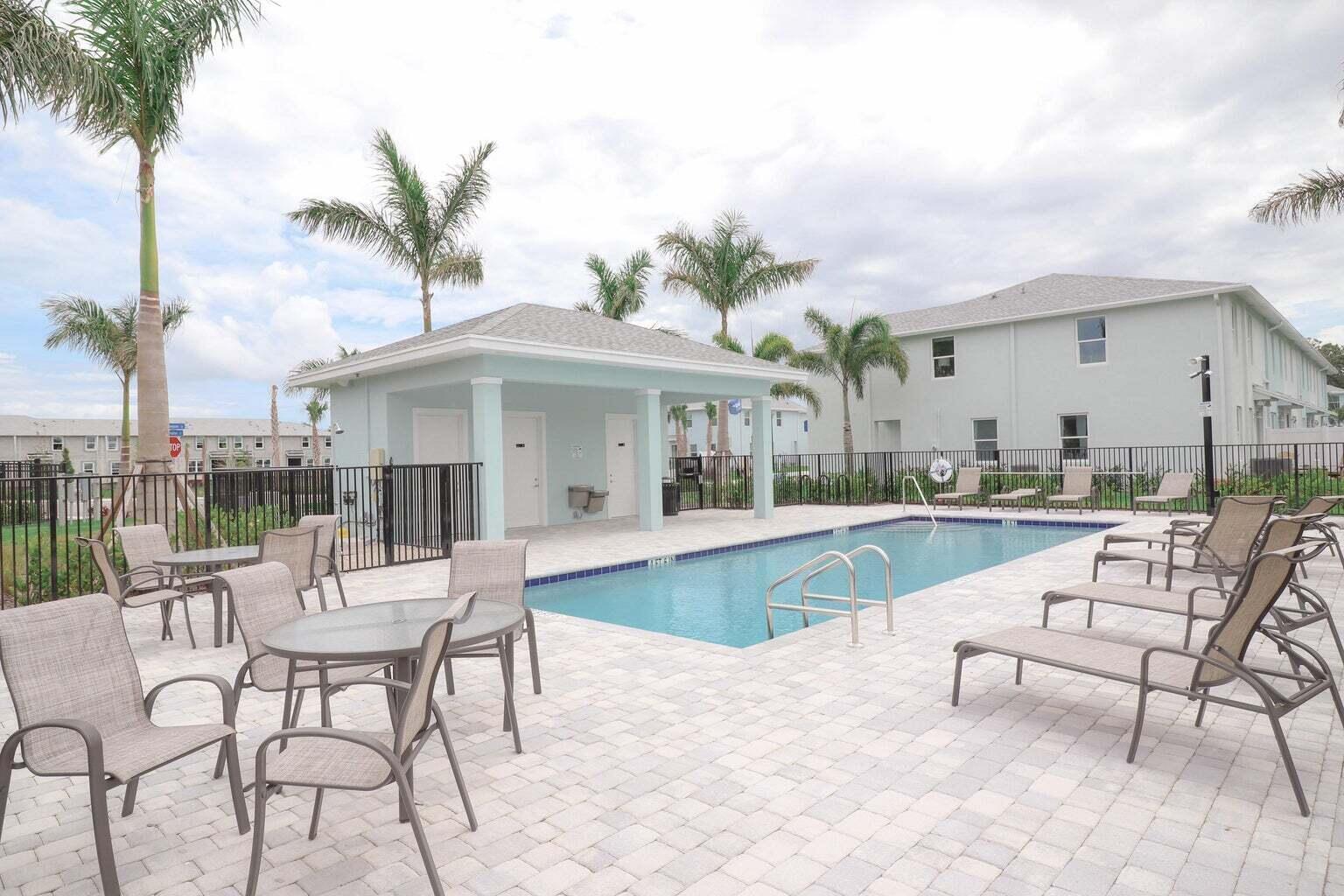 357 Southeast Angler Drive Stuart, FL 34994 - Photo 21 of 25 a view of a patio with swimming pool and furniture
