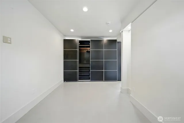 a view of an empty room with a window