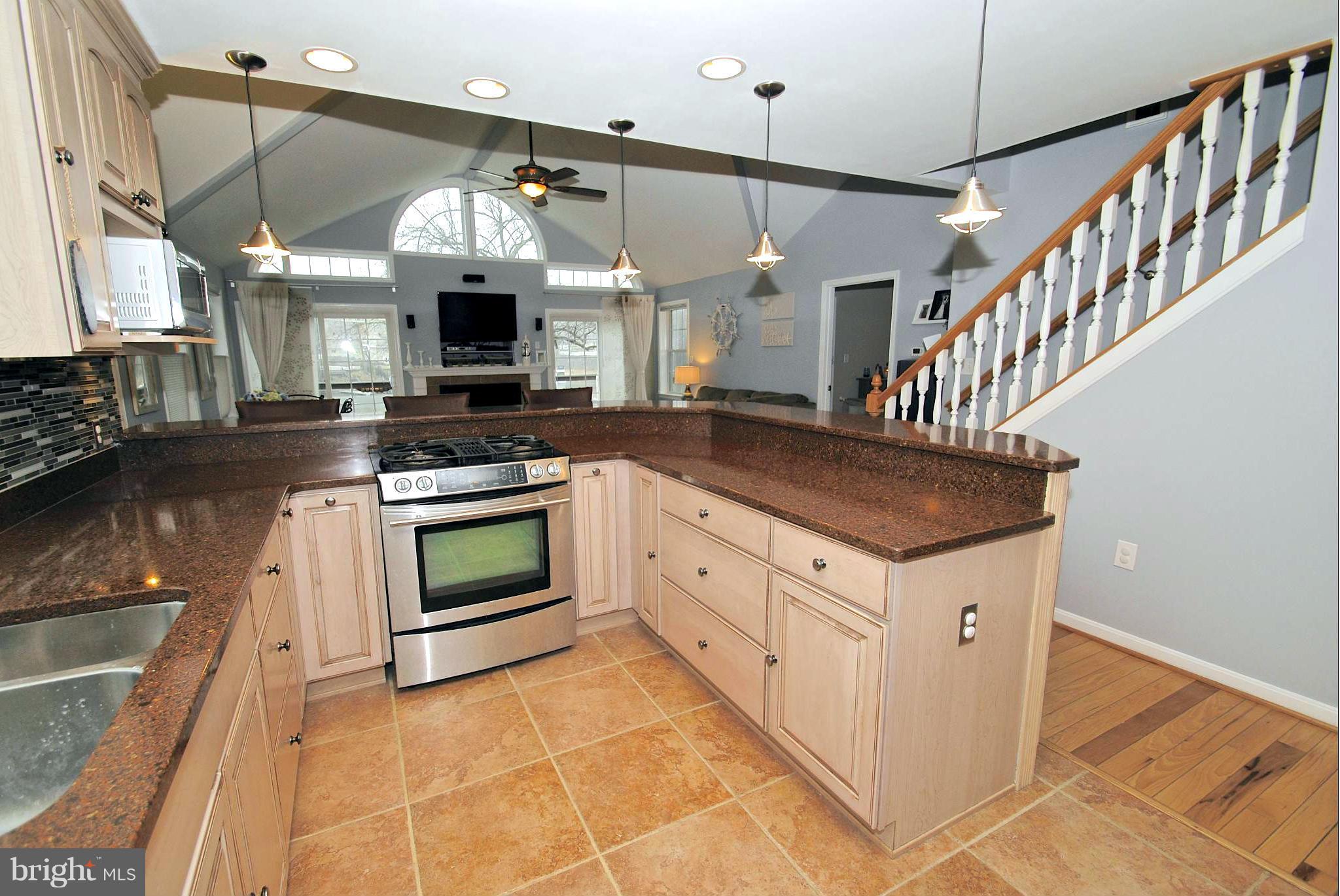 8366 Country Life Road Pasadena, MD 21122 - Photo 14 of 30 Tuscan Tile Floor and Stainless Appliances