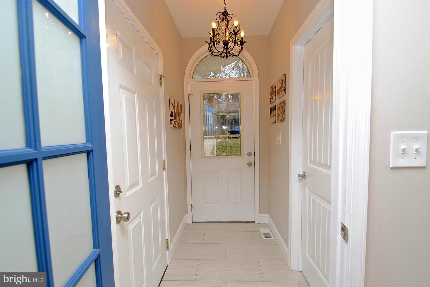 8366 Country Life Road Pasadena, MD 21122 - Photo 8 of 30 Tile Foyer with Palladian Transom