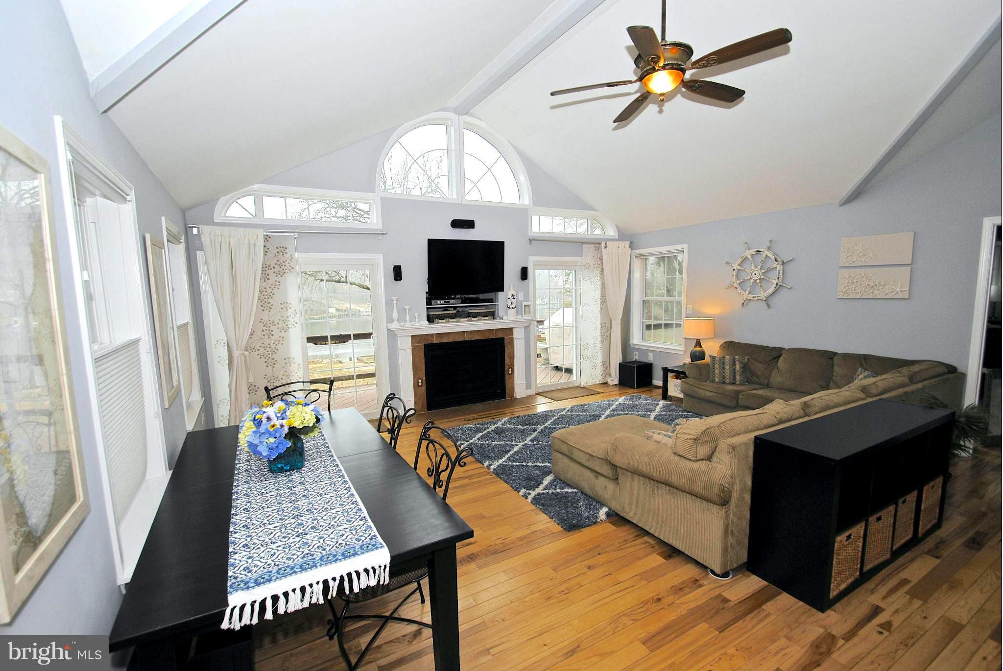 8366 Country Life Road Pasadena, MD 21122 - Photo 10 of 30 Fireplace Family Room with Hardwood Floors