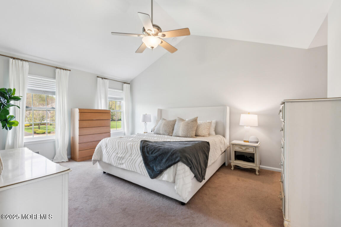 5 Trotter Way Cream Ridge, NJ 08514 - Photo 23 of 39 a spacious bedroom with a bed and a chandelier