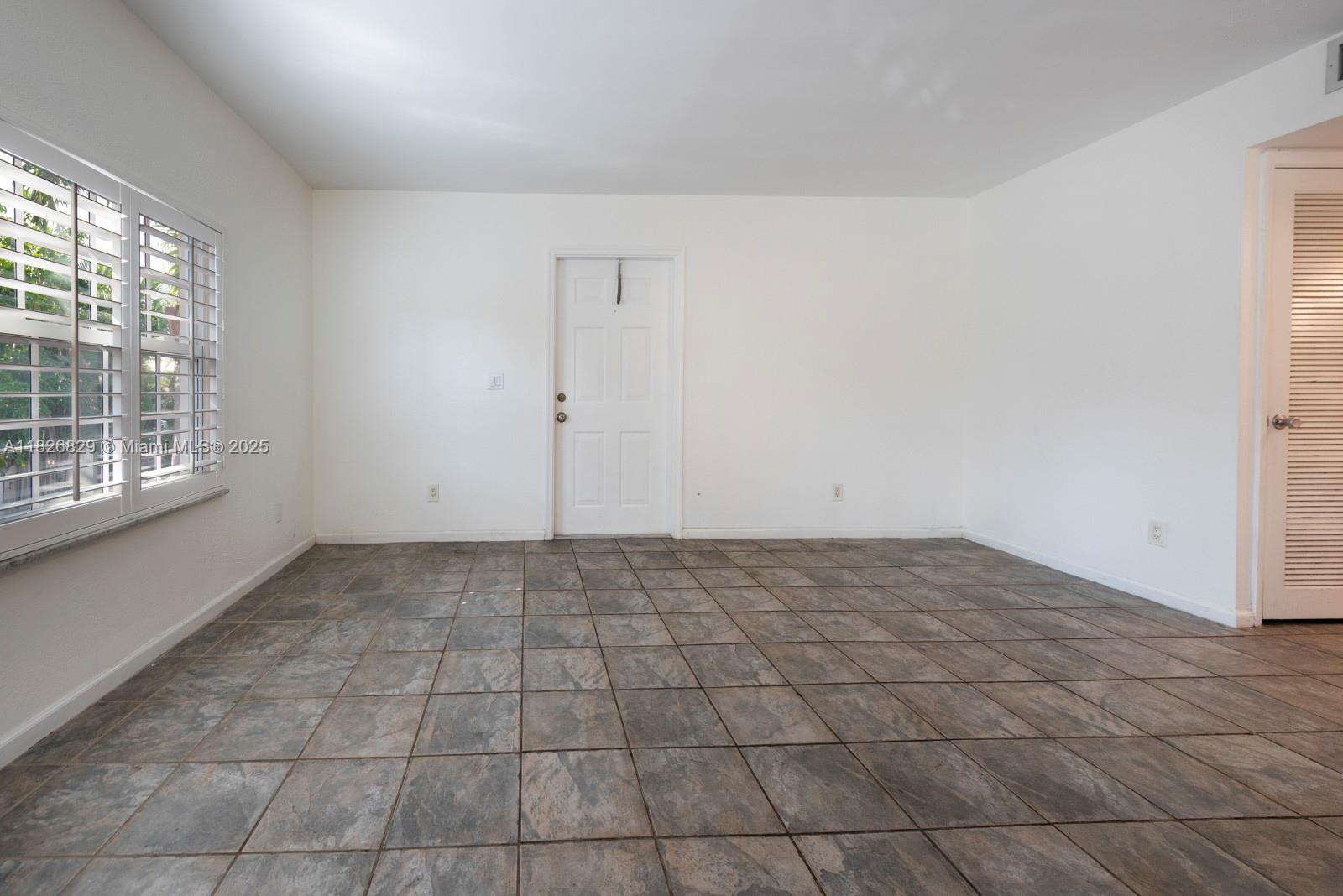 1405 Miami Road, Unit 20 Fort Lauderdale, FL 33316 - Photo 8 of 18 a view of an empty room and window in an empty room