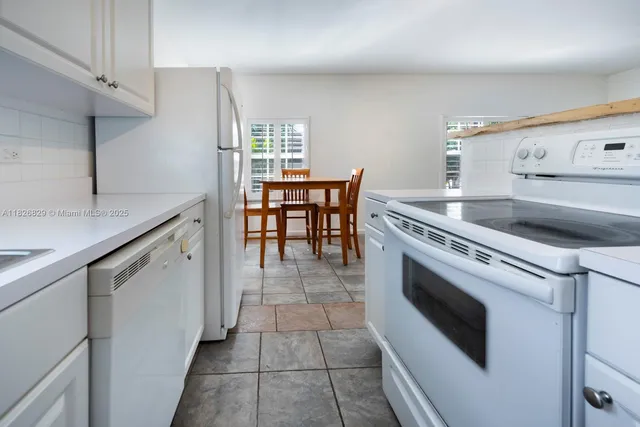 a kitchen with a stove and a sink