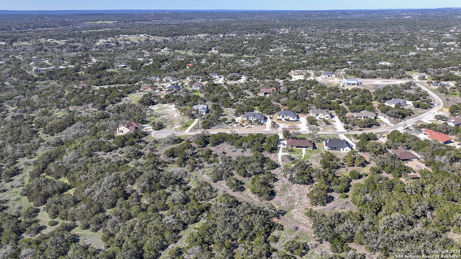 149 Alondra Lane Spring Branch, TX 78070 - Photo 13 of 46 an aerial view of house with yard and mountain view in back