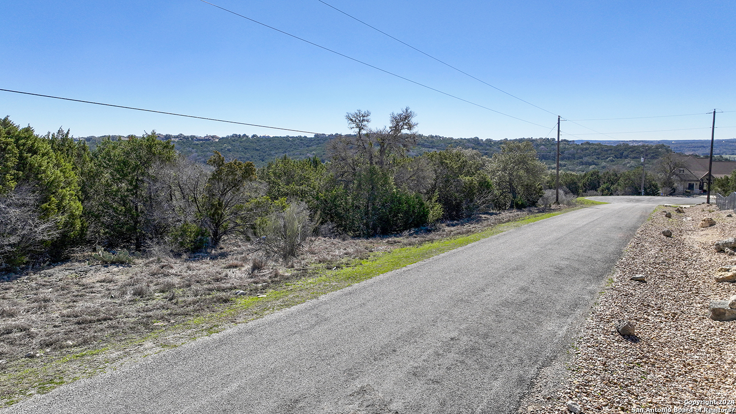 149 Alondra Lane Spring Branch, TX 78070 - Photo 26 of 46 a view of a road with a mountain in the background