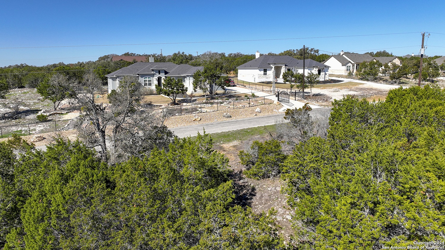 149 Alondra Lane Spring Branch, TX 78070 - Photo 29 of 46 a view of residential houses with a yard and lake view